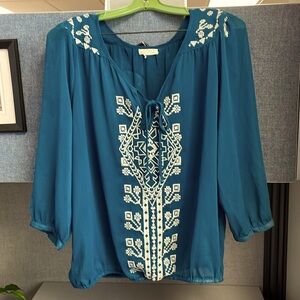 Teal blouse with cream embroidered detail